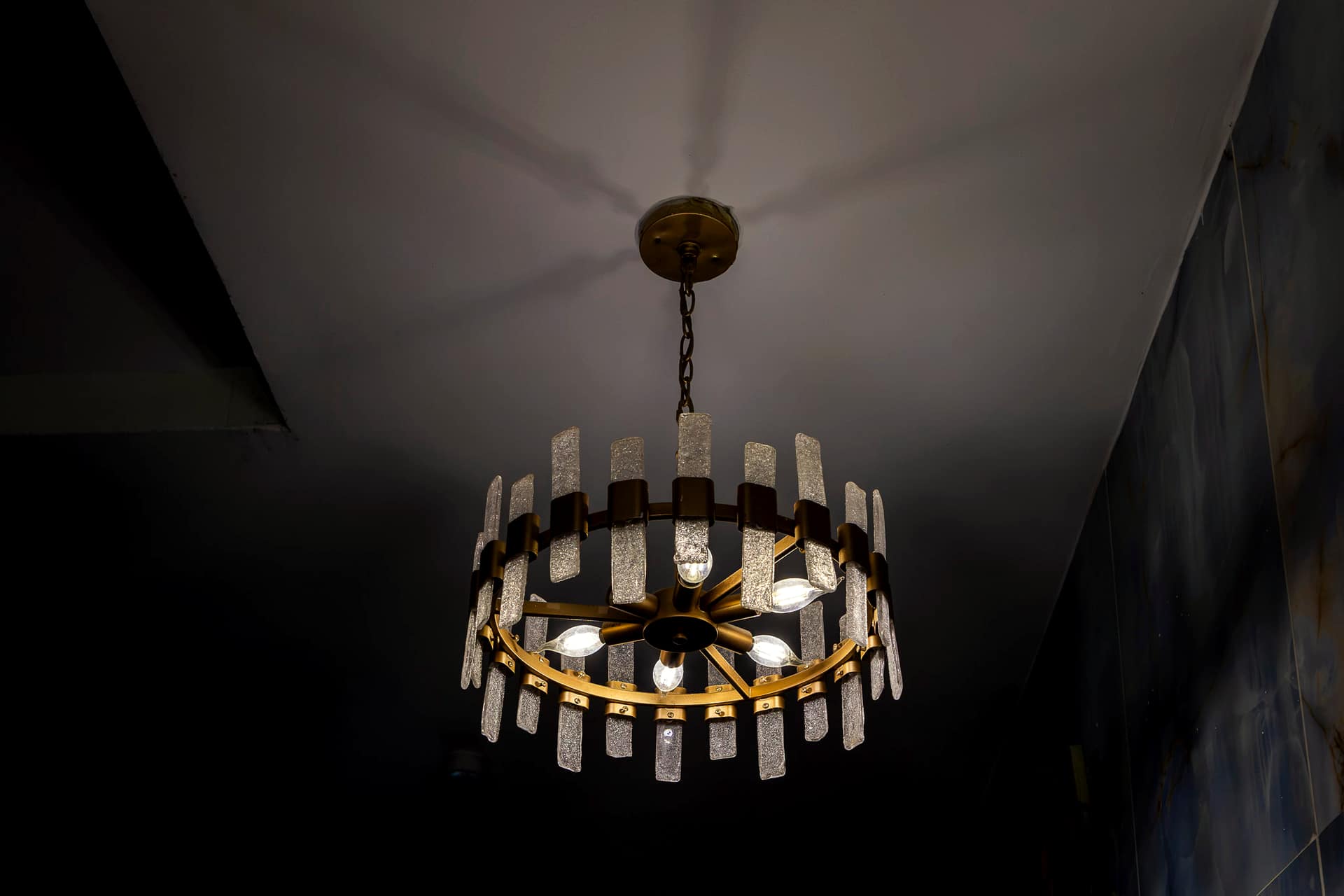 A chandelier at Hotel Medallion in low light