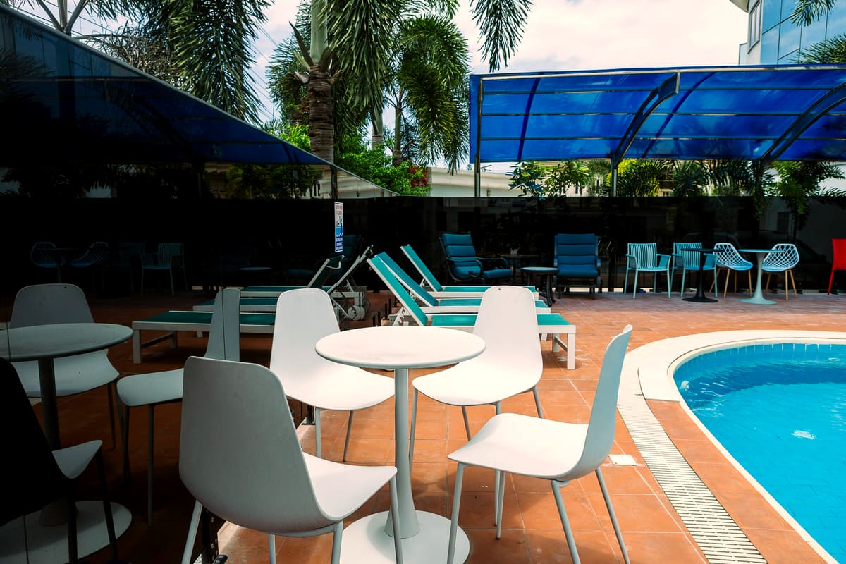 Sun loungers on the pool terrace at Hotel Medallion