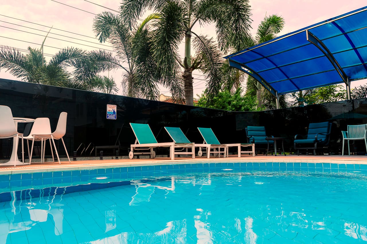 The outdoor pool and terrace at Hotel Medallion