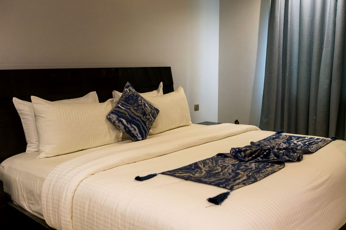 A made king bed in a Medallion suite