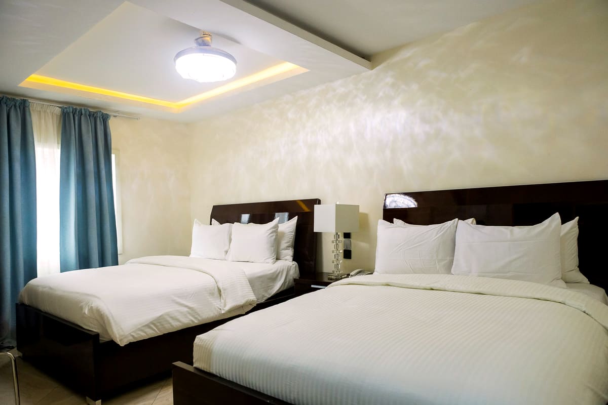 Two dressed beds in the Double Bed Deluxe Executive